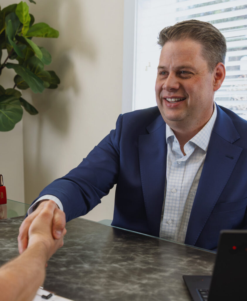 Jeff Cardon meeting with a client at his Pleasant Grove, Utah office.