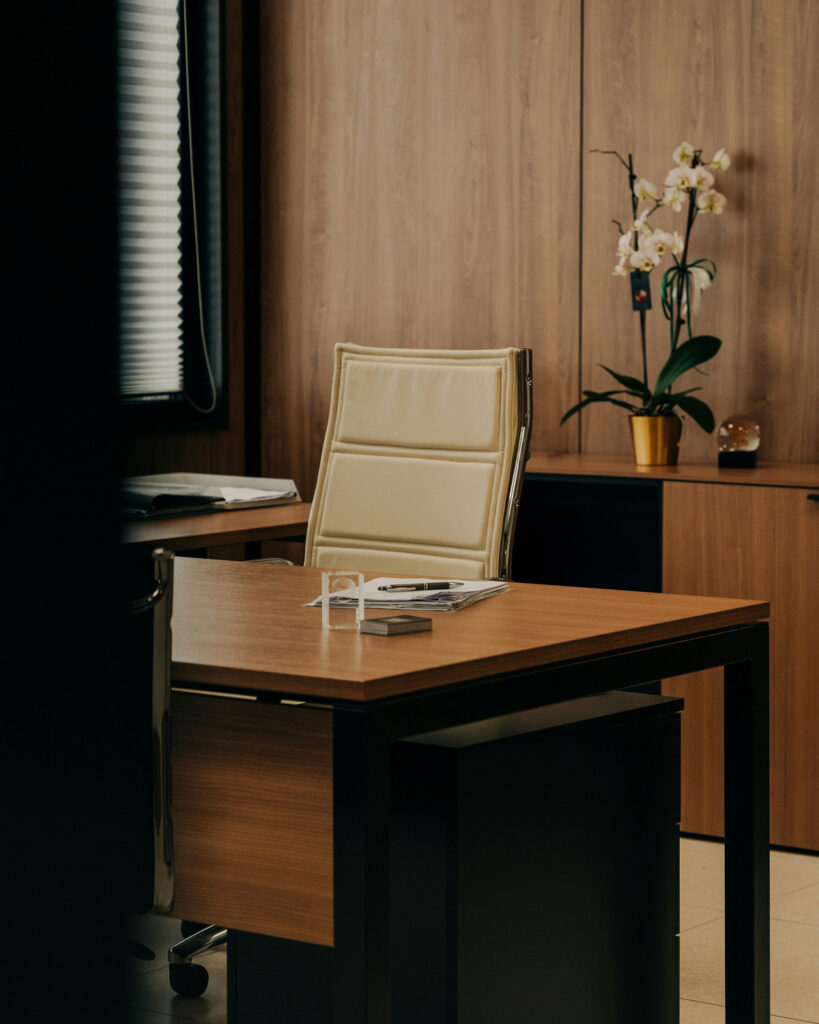 Refined executive office with warm wood finishes, representing strategic business planning, ownership decisions, and long-term continuity.